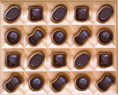 Sweet chocolate candies assortment in a box close-up. Top viewの写真素材