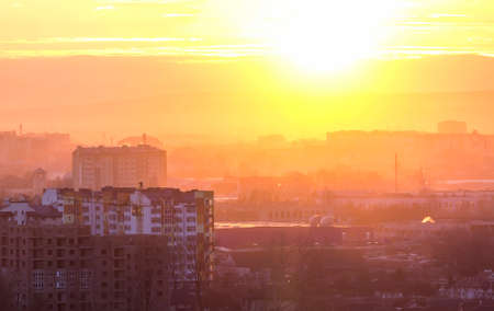 Panoramic view of beautiful yellow golden sunset over Ivano-Frankivsk city, Ukraine.の写真素材