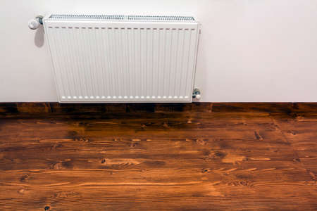 A white heating radiator on the interior wallの写真素材