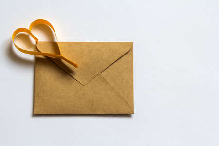 Love letter envelope with paper heart on white background. Happy Valentine's Day concept.