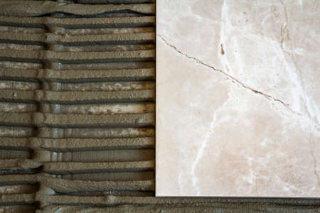Ceramic tiles and tools for tiler. Floor tiles installation. Home improvement, renovation - ceramic...