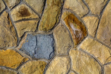 Different sizes of sand stones. Stone wall pattern background