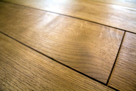 Natural brown texture wooden parquet floor boardsの写真素材