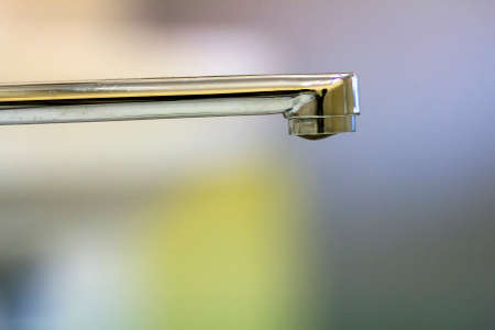Close-up of faucet in modern bathroom. Horizontal crop with shallow depth of field