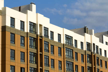 Condominium or modern apartment building with symmetrical architecture in the city downtown. Real...