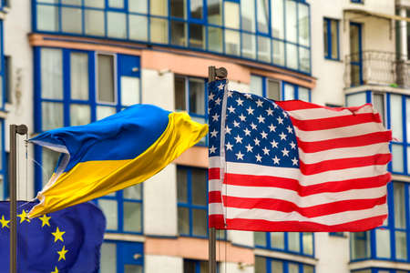 Close up of the us flag against city skyline