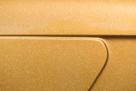 Golden abstract glitter orange yellow flat surface with blinking white irregular spots. Blurred bokeh, glamour texture. Vintage or grunge copy space background, retro pattern wall.の写真素材