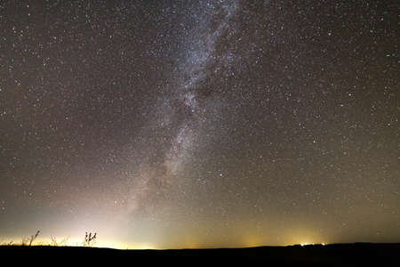 Beautiful wide panorama, rural landscape at night. Boundless dark sky with myriads of white...