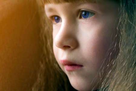 Close up portrait of happy smiling little girl with beautiful thick hairの写真素材