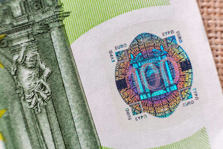 Money, busyness and finances concept. Detail part of banknote euro national currency bill. Symbol of wealth and prosperity.の写真素材