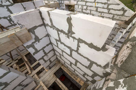 Top view of future cottage energy saving walls of large white hollow foam insulation blocks and...