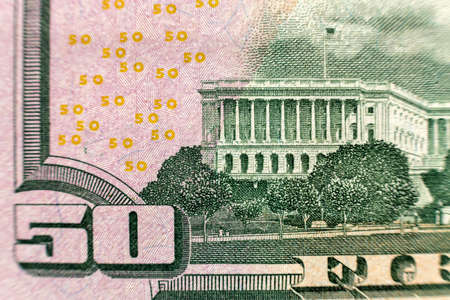 Money colorful background close-up. Details of American national currency banknotes bills. Symbol of...