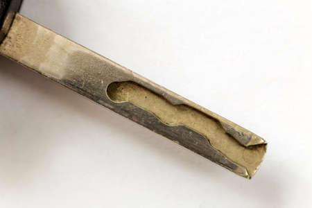 Close-up of car key detail on white copy space background. Vehicle lock and keys design, security...