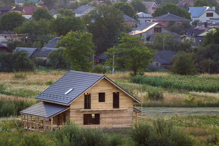 Aerial view of new wooden ecological traditional house cottage of natural lumber materials with...
