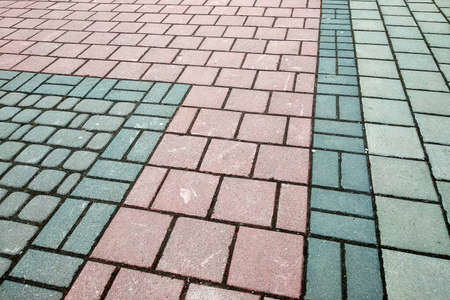 Stone pavement in perspective. Granite cobblestone pavement tiles.