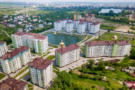 Top view of apartment or office tall buildings, parked cars, urban city landscape. Drone aerial...