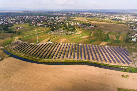Aerial view of solar power plant. Electric panels for producing clean ecologic energy.