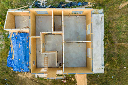 Construction of new and modern modular house. Walls made from composite wooden sip panels with foam insulation inside. Building new frame of energy efficient home concept.の写真素材