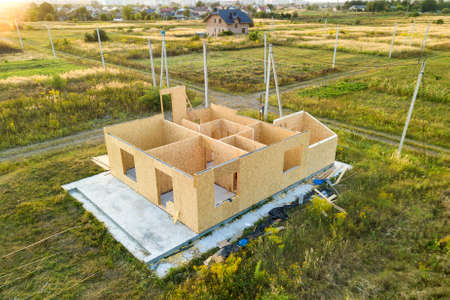 Construction of new and modern modular house. Walls made from composite wooden sip panels with foam insulation inside. Building new frame of energy efficient home concept.