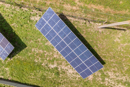Aerial view of solar panels in rural country area.