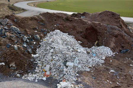 Pile of broken garbage plaster at construction site.