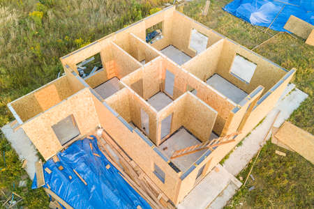 Construction of new and modern modular house. Walls made from composite wooden sip panels with...