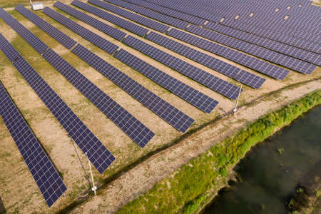 Aerial view of solar power plant. Electric panels for producing clean ecologic energy.