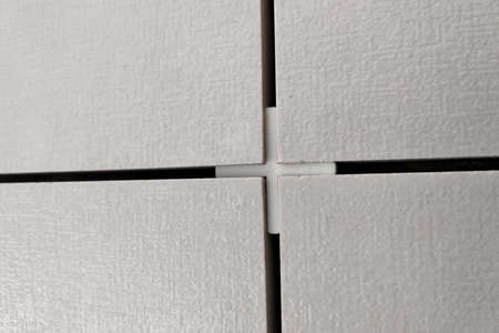 Wall ceramic tiles installation on mortar glue.