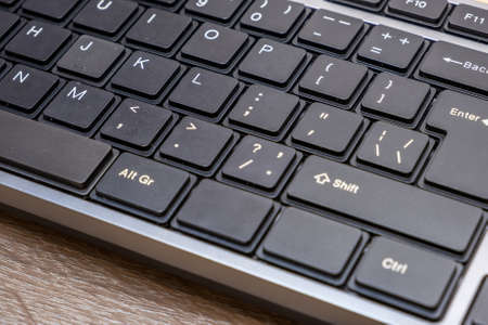 Close up of black keyboard on office desk.