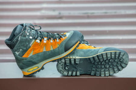 A pair of leather trekking hiking winter boots on blurred backgroundの写真素材