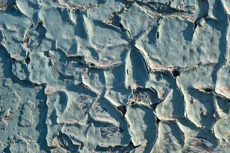 Closeup surface of old blue cracked paint.