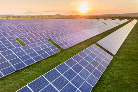 Blue solar photo voltaic panels system producing renewable clean energy on rural landscape and...