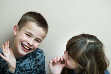 Two children boy and girl fooling around having fun together. Happy childhood concept.の写真素材
