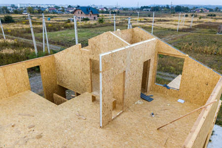 Construction of new and modern modular house. Walls made from composite wooden sip panels with foam...