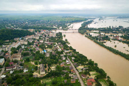 Aerial view of Dnister river with dirty water and  flooded houses in Halych town, western Ukraine.