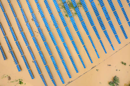 Aerial view of flooded solar power station with dirty river water in rain season.の写真素材