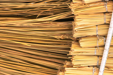 Close up detail of yellow straw roof.