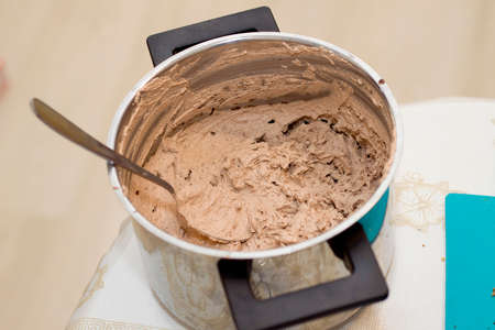Close up of whipped sweet chocolate cream in shiny pan. Culinary, baking and delicious dessert...