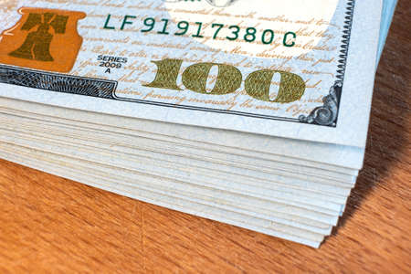 Close up detail of one hundred US dollars bills.