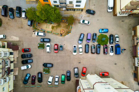 Aerial view of many colorful cars parked on public parking lot.のeditorial素材