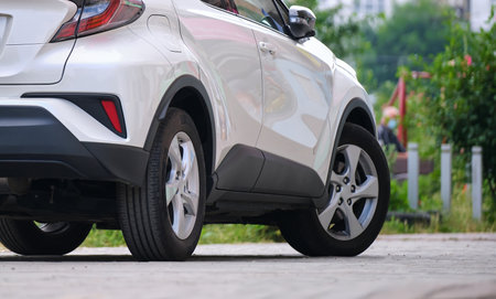 Close up of a car parked on city street side.