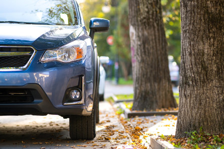 New clean car parked on a city street side.の写真素材