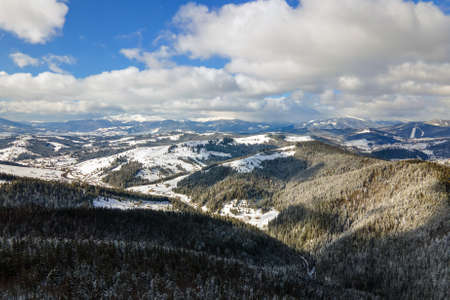 Winter landscape with spruse trees of snow covered forest in cold mountains.の写真素材