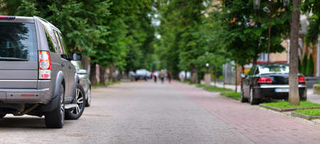 Close up of a car parked on city street side.の写真素材