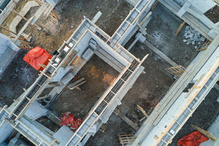 Aerial view of unfinished frame of private house foundation under construction