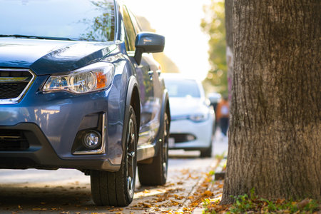 New clean car parked on a city street sideの写真素材