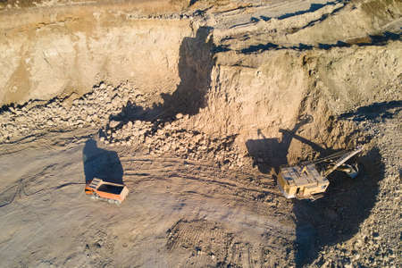 Aerial view of open pit mine of sandstone materials for construction industry with excavators and...