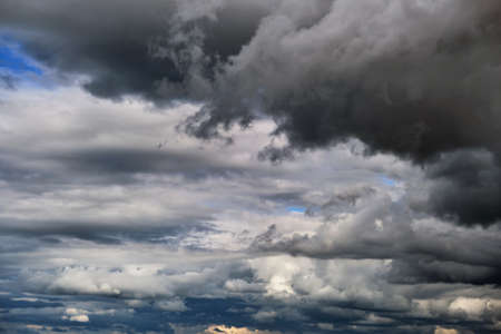 Landscape of dark clouds forming on stormy sky during thunderstorm