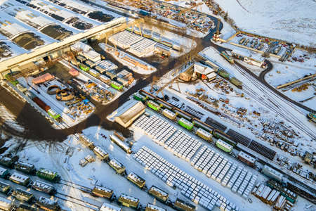 Aerial view of cargo train loaded with crushed sandstone materials at mine factory. Railway transportation of open pit mining oreの写真素材