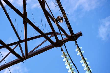 Electric power lines divided by safe guard insulating frame transfening safely high voltage...
